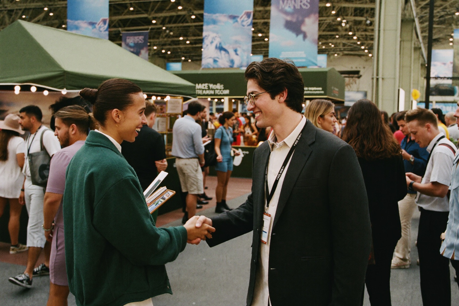 A handshake at a travel trade show stand
