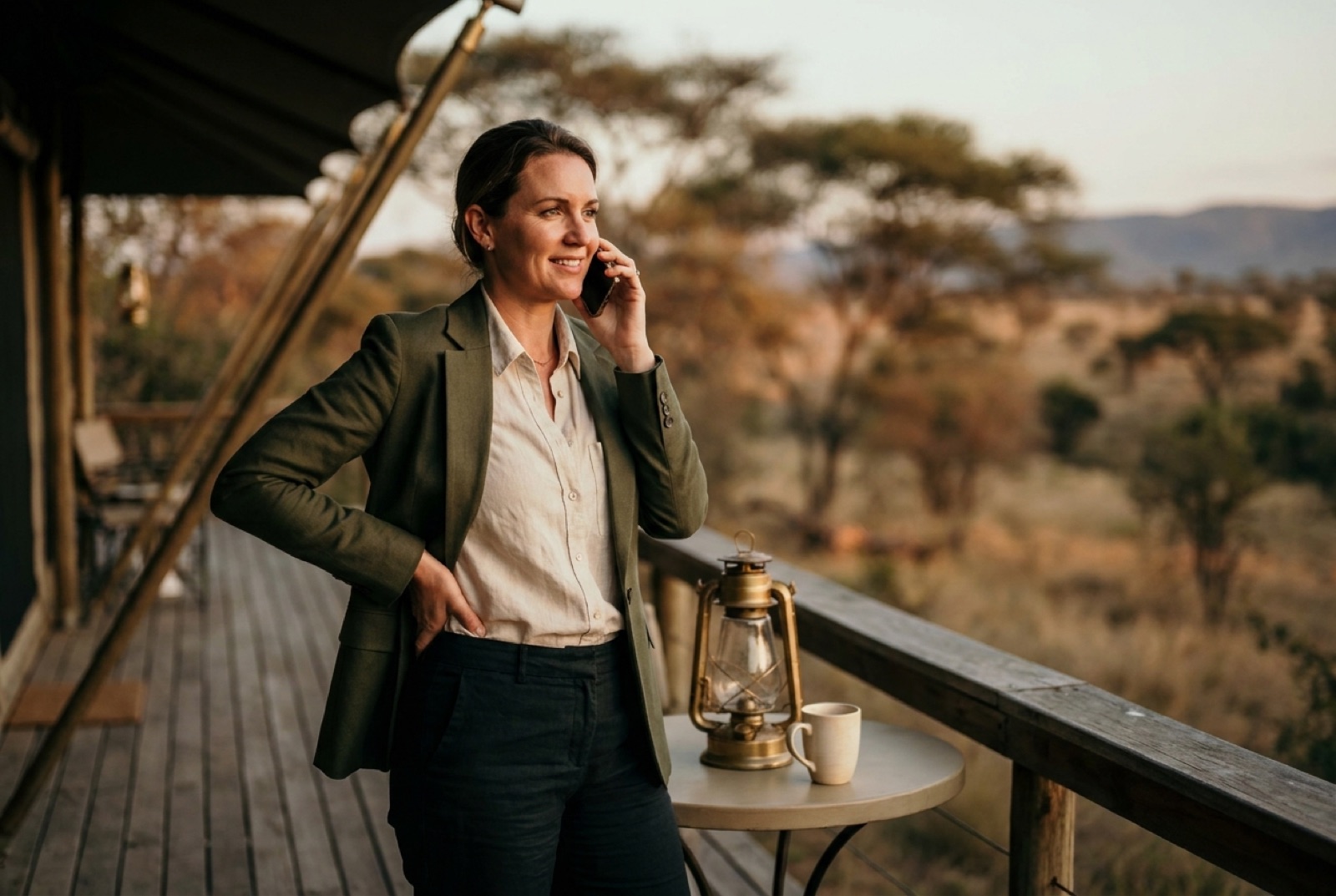 A rep recording a voice note on a lodge deck at dusk